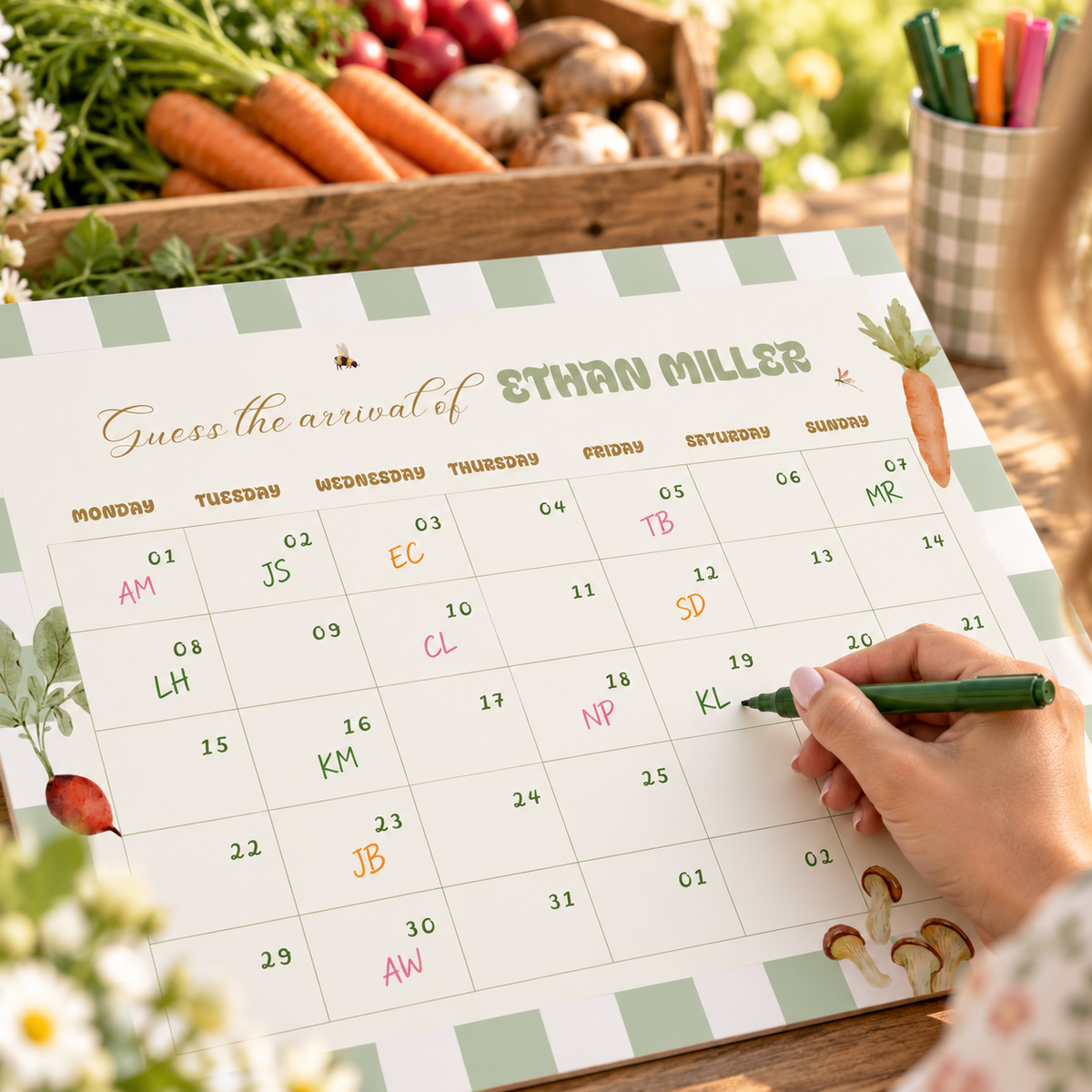 Guest writing initials on a date of the Locally Grown guess the due date calendar