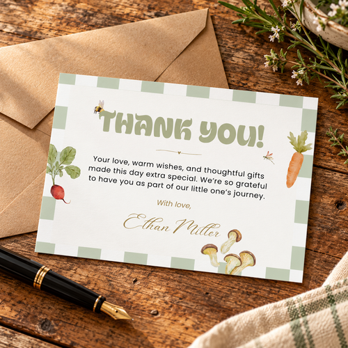 Locally Grown farmers market baby shower thank you card on a wooden desk with a kraft envelope, pen and herbs