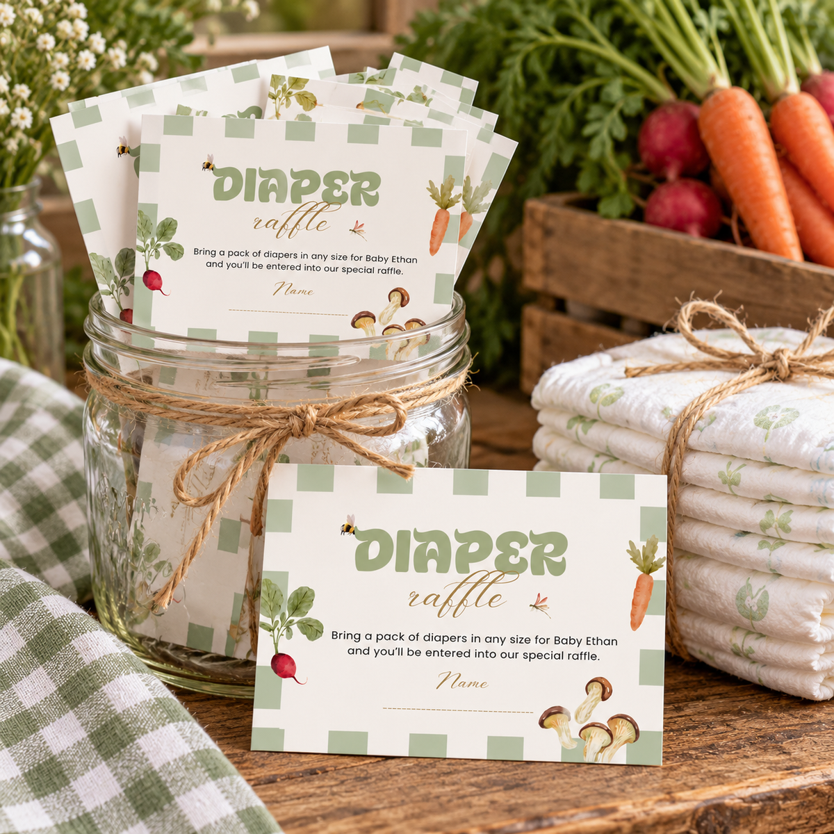 Locally Grown diaper raffle cards in a mason jar next to a stack of diapers tied with twine