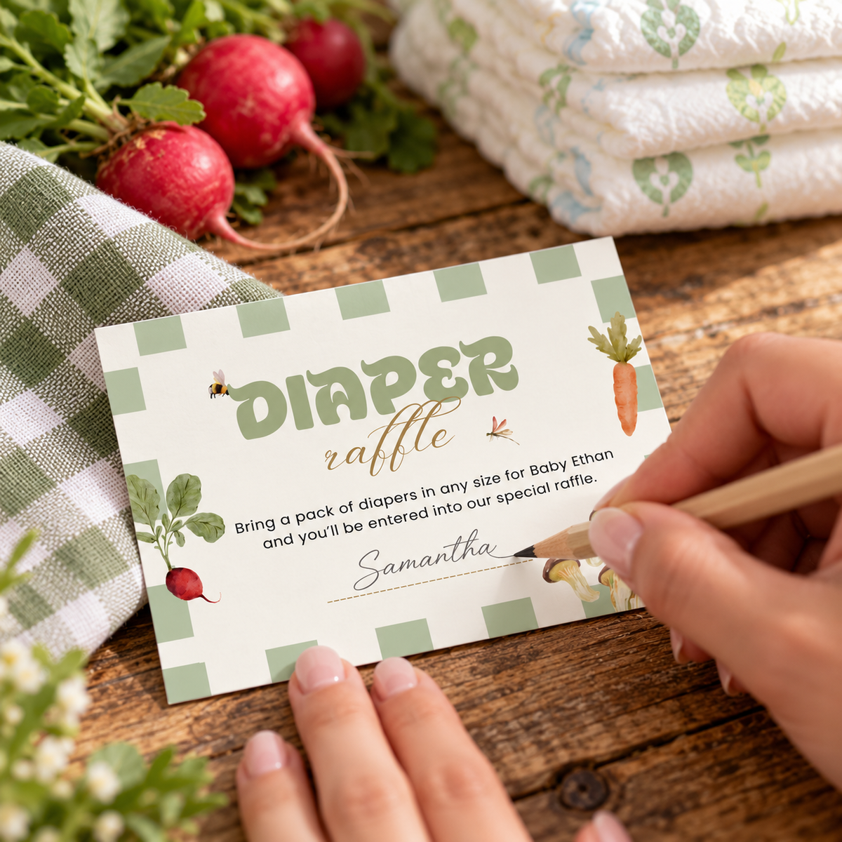 Guest writing her name on a Locally Grown diaper raffle card