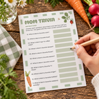 Guest filling in the Locally Grown Mom Trivia baby shower game card