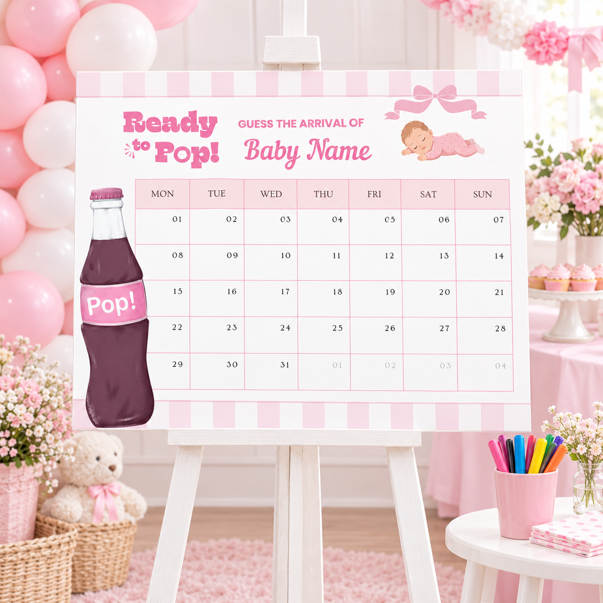 Ready To Pop baby shower due date calendar on an easel with pink balloons and a cup of markers