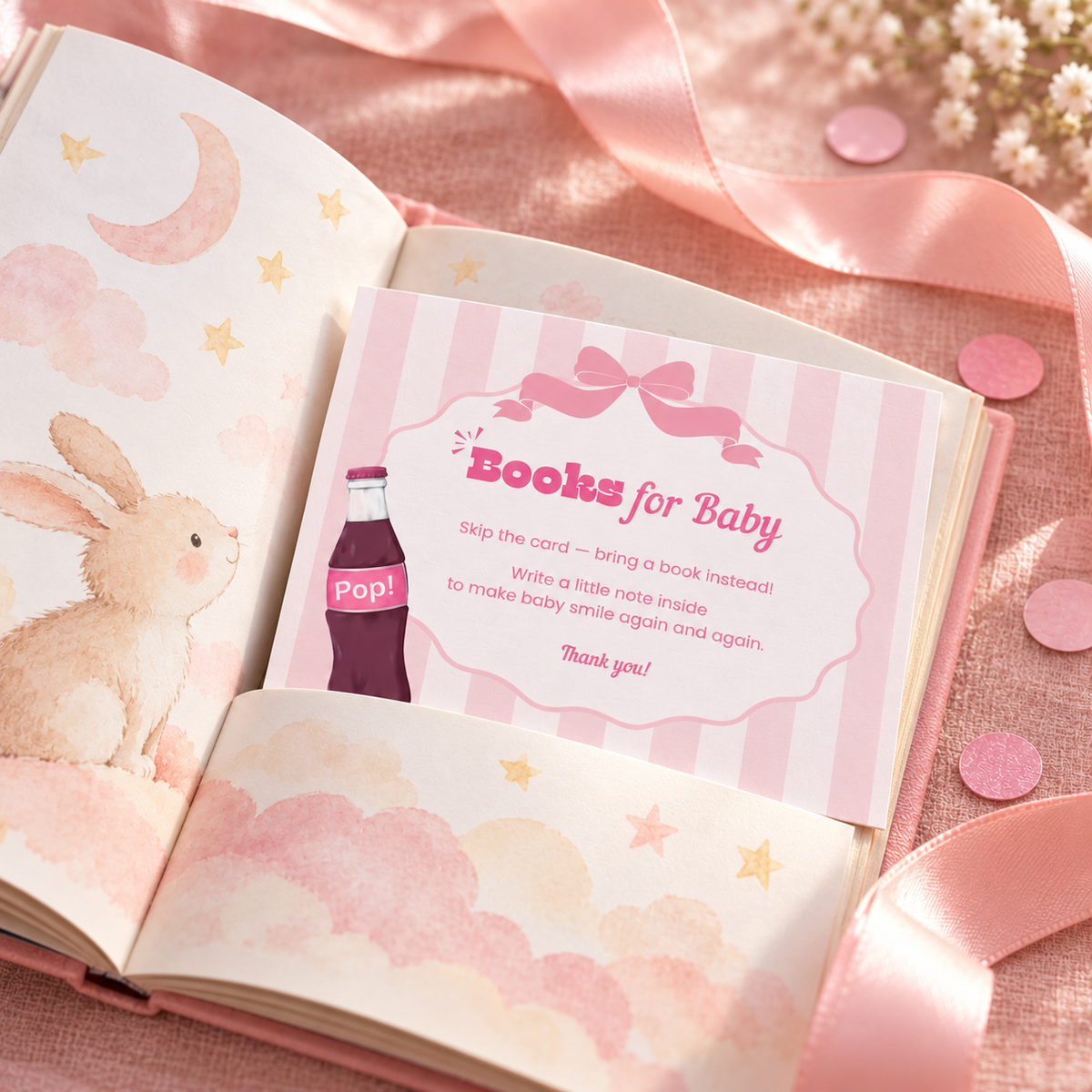 Close-up of the Ready To Pop books for baby card tucked into an open picture book