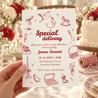 Hand holding the Special Delivery stork baby shower invitation at a party table