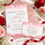 Sweet Little Valentine books for baby card tucked with the matching baby shower invitation on a blush envelope with pink and red roses