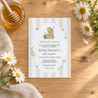 Classic Honey Bear baby shower invitation on a wooden table with a honey jar, honey dipper and daisies
