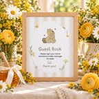 Close-up of the framed Classic Honey Bear Guest Book sign with yellow flowers and a honey jar