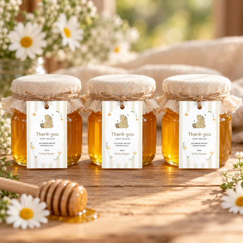 Classic Honey Bear baby shower favor tags tied with jute twine to three small honey jars