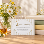 Classic Honey Bear books for baby card leaning against a stack of children's books with daisies