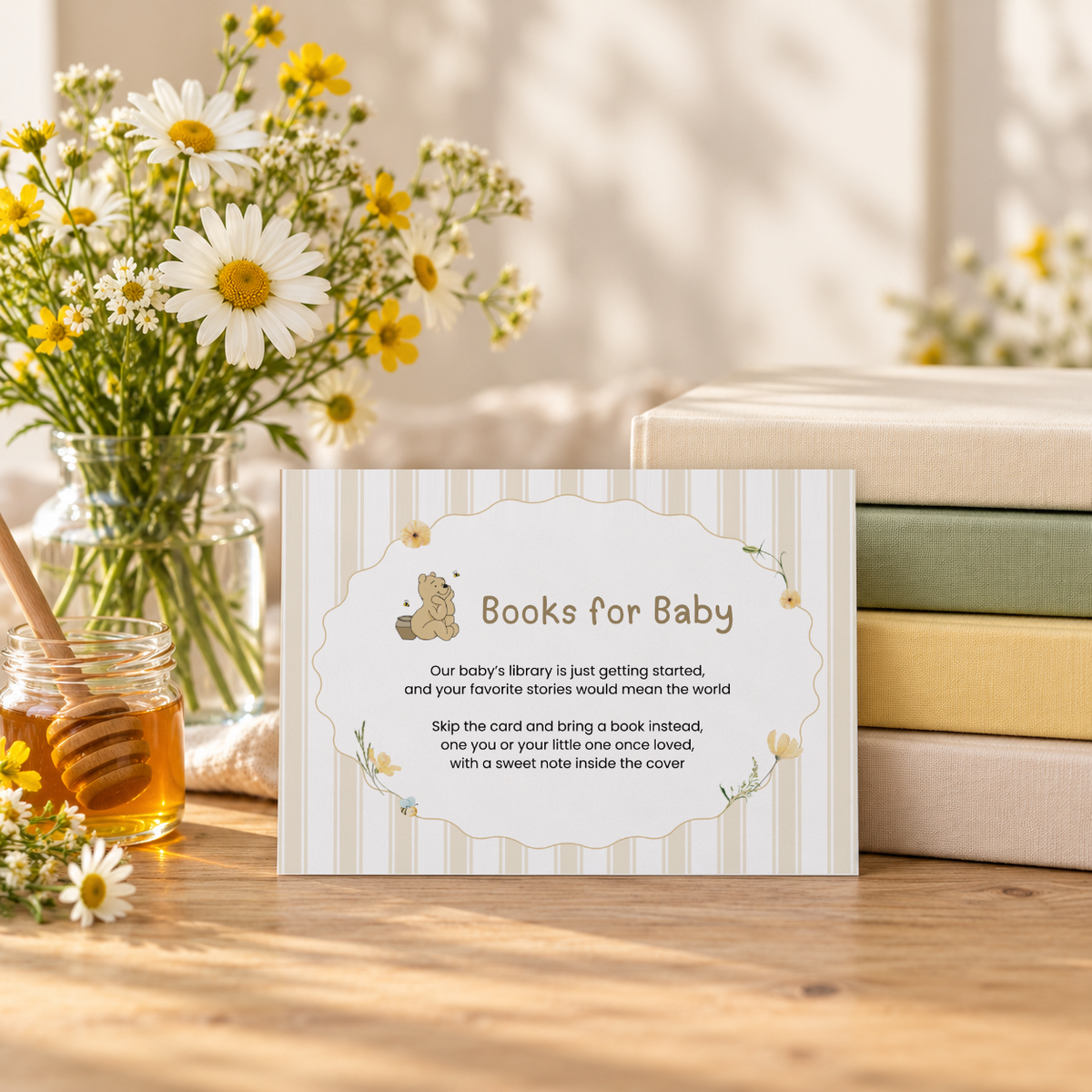 Classic Honey Bear books for baby card leaning against a stack of children's books with daisies